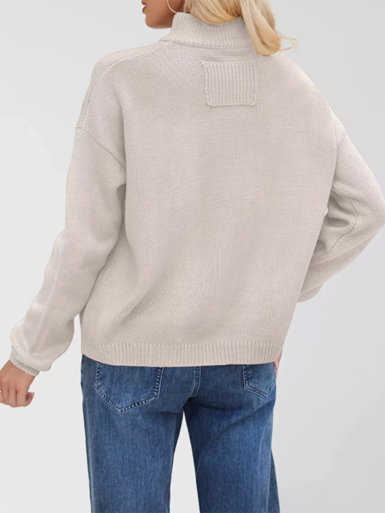 Women's casual knit button-down cardigan in ivory featuring a stand collar, chest pocket, front pockets, and ribbed trim. Cozy boutique sweater perfect for layering with jeans and fall outfits.