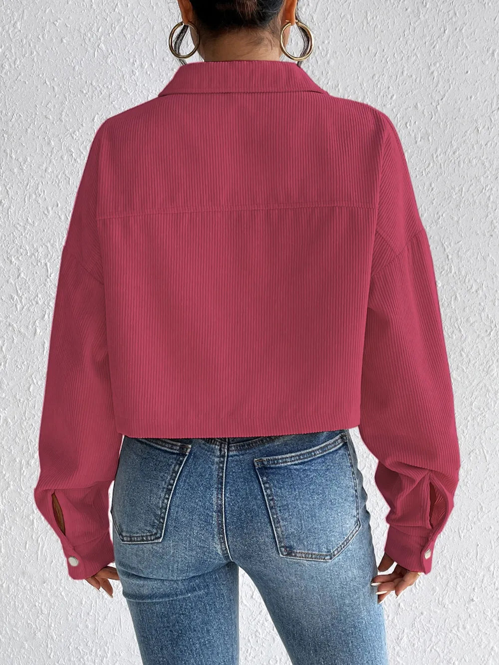 Woman wearing the Honey Snap Down Long Sleeve Jacket in cerise with blue jeans and a white top, lightweight women's fall jacket from Chic Mystik Boutique.