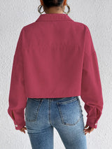 Woman wearing the Honey Snap Down Long Sleeve Jacket in cerise with blue jeans and a white top, lightweight women's fall jacket from Chic Mystik Boutique.
