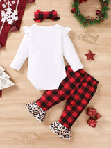 Baby girl wearing a Christmas tree graphic long sleeve top, red and black plaid ruffle pants and matching bow headband.