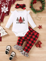 Baby girl wearing a Christmas tree graphic long sleeve top, red and black plaid ruffle pants and matching bow headband.
