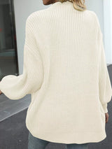 Women's oversized beige chunky knit open front cardigan with long balloon sleeves, soft textured sweater perfect for fall layering with jeans.