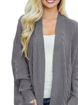 Women's chunky cable knit open front cardigan with front pockets in dark gray. Cozy fall sweater perfect for layering with jeans, dresses, leggings, and boots.