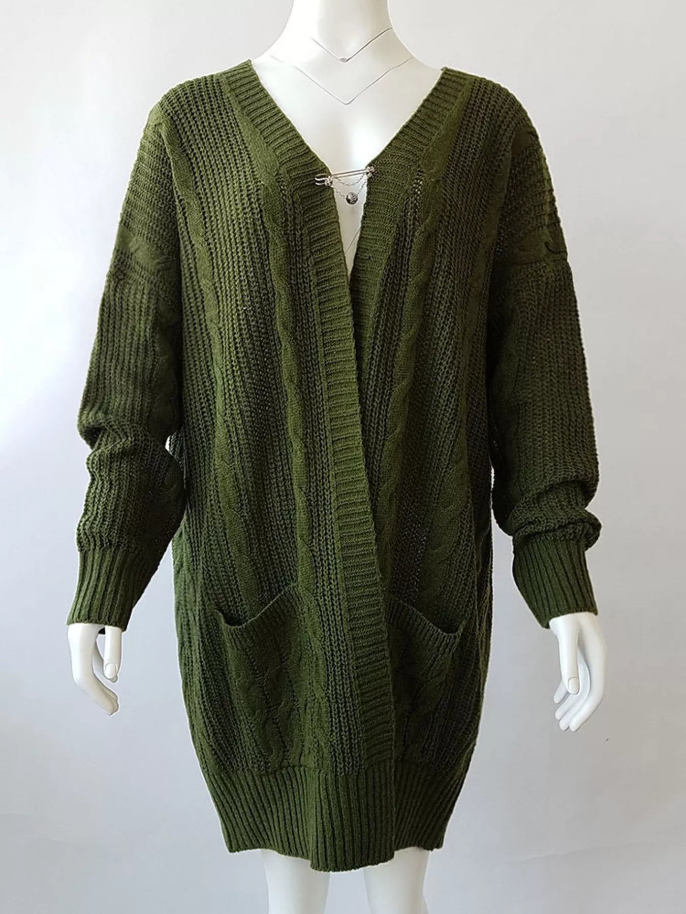 Women's chunky cable knit open front cardigan with front pockets in green. Cozy fall sweater perfect for layering with jeans, dresses, leggings, and boots.