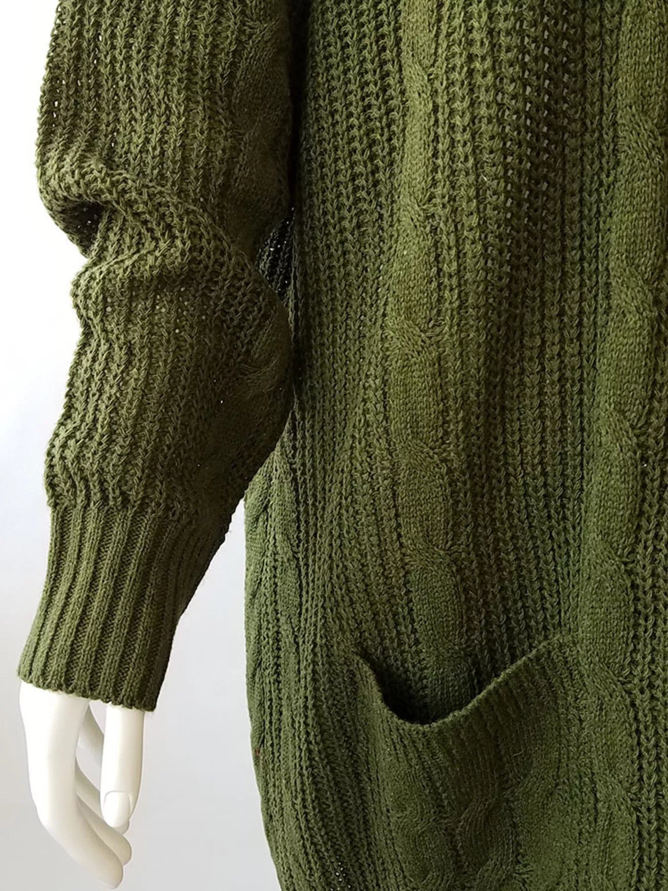 Women's chunky cable knit open front cardigan with front pockets in green. Cozy fall sweater perfect for layering with jeans, dresses, leggings, and boots.