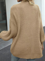 Women's oversized khaki chunky knit open front cardigan with long balloon sleeves, soft textured sweater perfect for fall layering with jeans.
