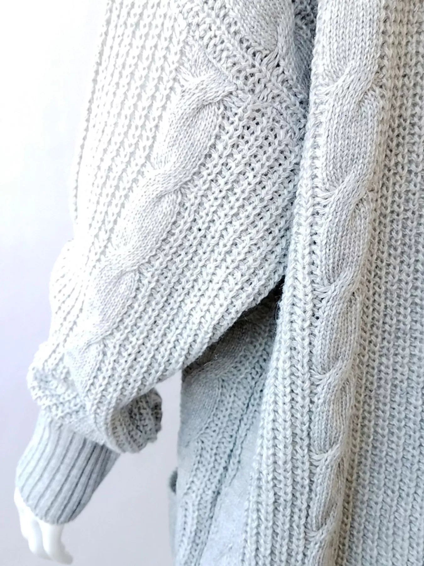 Women's chunky cable knit open front cardigan with front pockets in light gray. Cozy fall sweater perfect for layering with jeans, dresses, leggings, and boots.