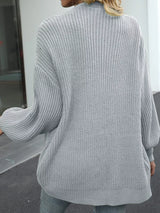 Women's oversized light gray chunky knit open front cardigan with long balloon sleeves, soft textured sweater perfect for fall layering with jeans.
