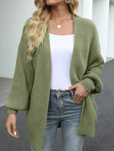 Women's oversized matcha green chunky knit open front cardigan with long balloon sleeves, soft textured sweater perfect for fall layering with jeans.
