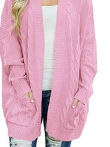 Women's chunky cable knit open front cardigan with front pockets in pink. Cozy fall sweater perfect for layering with jeans, dresses, leggings, and boots.