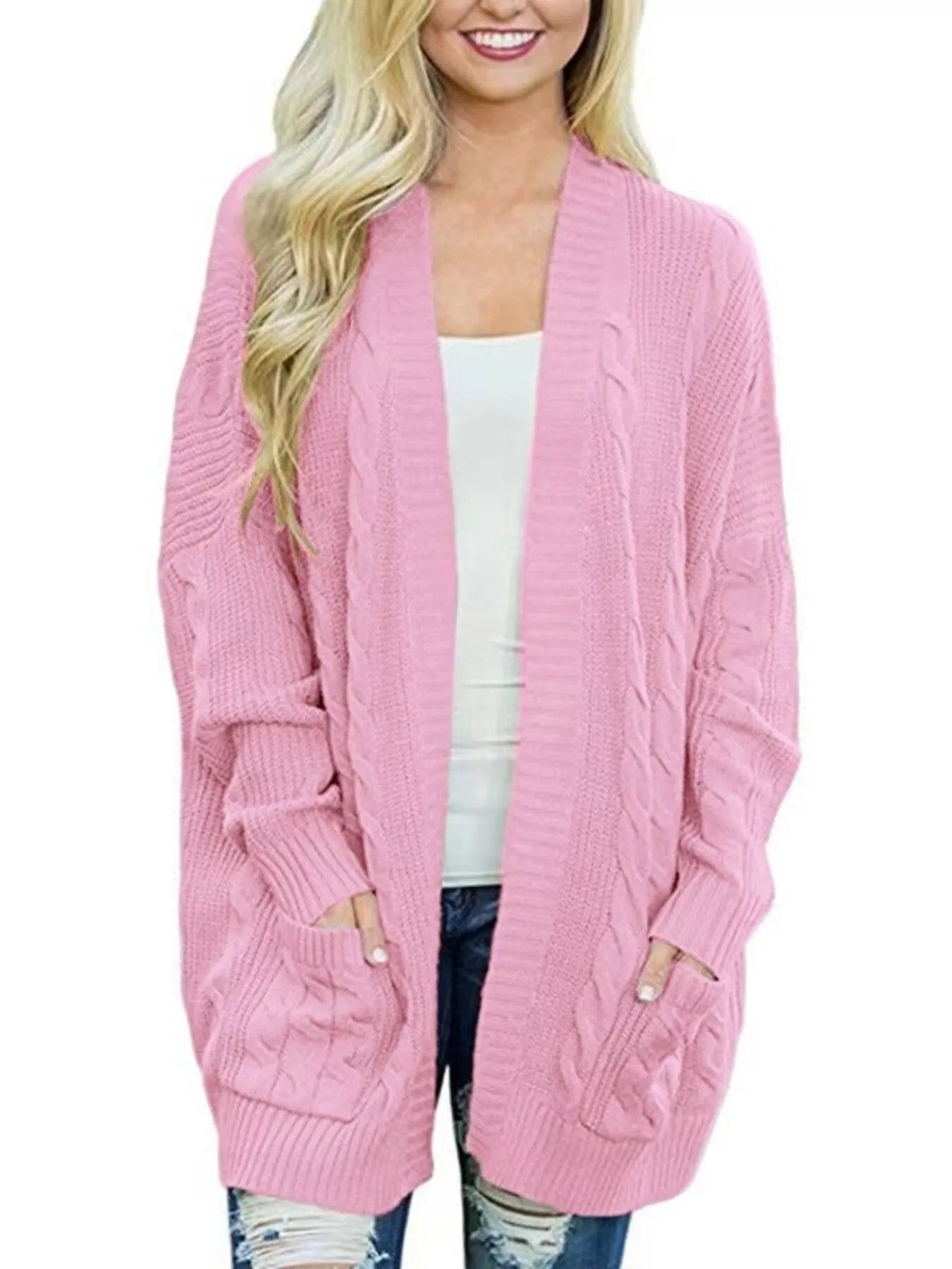 Women's chunky cable knit open front cardigan with front pockets in pink. Cozy fall sweater perfect for layering with jeans, dresses, leggings, and boots.