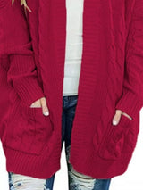 Women's chunky cable knit open front cardigan with front pockets in wine red. Cozy fall sweater perfect for layering with jeans, dresses, leggings, and boots.