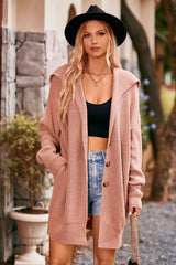 Women's burnt coral collared neck button-up cardigan with front pockets, oversized knit sweater layered over a black tank and denim shorts for stylish fall fashion.