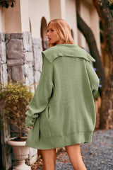 Women's gum leaf collared neck button-up cardigan with front pockets, oversized knit sweater layered over a black tank and denim shorts for stylish fall fashion.