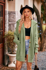 Women's gum leaf collared neck button-up cardigan with front pockets, oversized knit sweater layered over a black tank and denim shorts for stylish fall fashion.