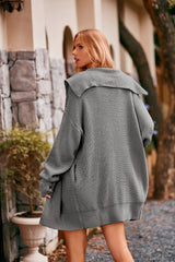 Women's heather gray collared neck button-up cardigan with front pockets, oversized knit sweater layered over a black tank and denim shorts for stylish fall fashion.