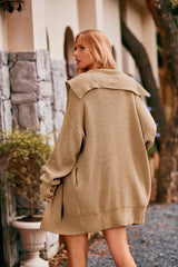 Women's tan collared neck button-up cardigan with front pockets, oversized knit sweater layered over a black tank and denim shorts for stylish fall fashion.