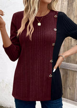 Women’s burgundy and black color block ribbed knit long sleeve top with decorative side buttons and slit detail, available in sizes Small–2XL.