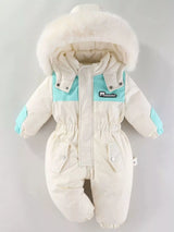 Children's cream one-piece winter snowsuit featuring a fluffy white faux fur-trimmed hood, rust-colored accents, elasticized waist, and front pockets.