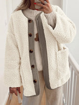 Women's cream contrast button up sherpa jacket with pockets and long sleeves.