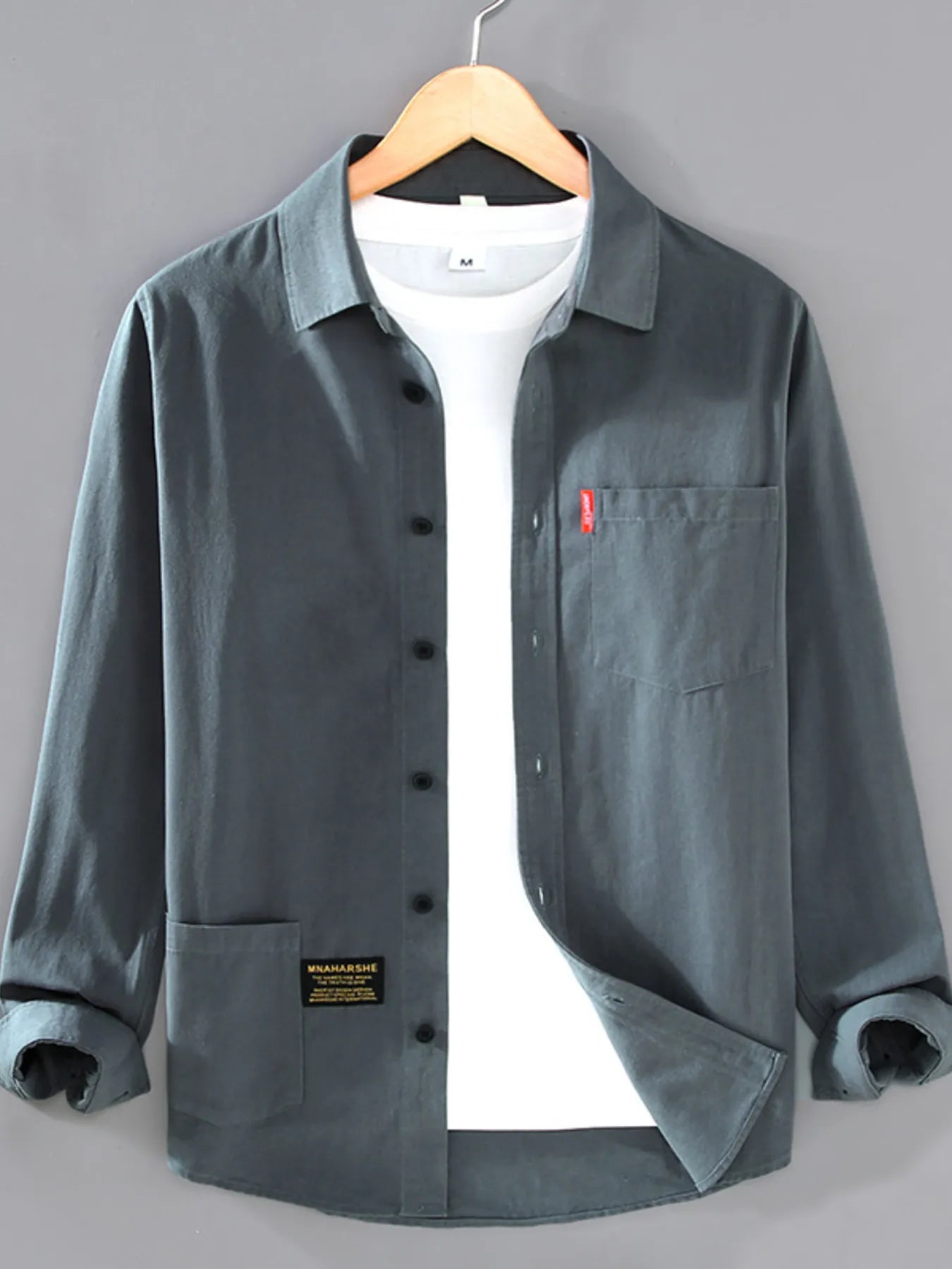 Men’s dark gray plus size button-up long sleeve shirt with multiple pockets, shown layered over a white T-shirt.