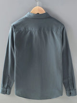 Men’s dark gray plus size button-up long sleeve shirt with multiple pockets, shown layered over a white T-shirt.