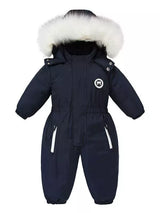 Children's dark navy one-piece winter snowsuit featuring a fluffy white faux fur-trimmed hood, rust-colored accents, elasticized waist, and front pockets.