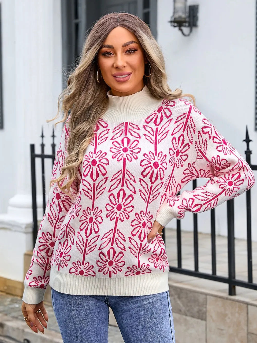 Women’s deep red and white floral turtleneck long sleeve sweater with allover flower pattern.