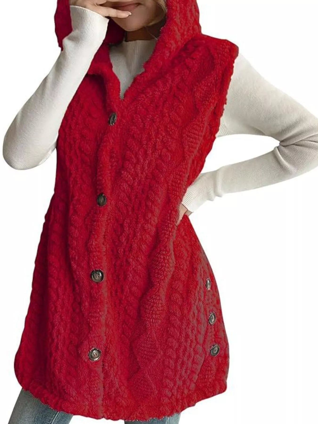Woman wearing a deep red hooded sherpa vest coat over a white long-sleeve top with blue jeans for a cozy fall and winter outfit.