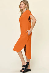 Women's tangerine round neck short sleeve midi dress with side slit and relaxed fit, available in sizes Small–3XL.