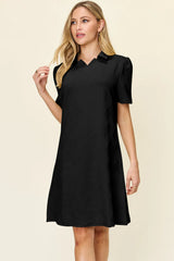 Woman wearing a black dress against a beige background