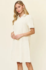 Woman wearing a cream dress against a beige background