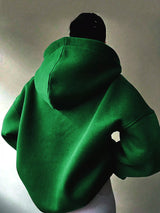 Women's oversized dropped shoulder hoodie sweatshirt in green with long sleeves and relaxed fit, perfect for casual fall outfits, available in 11 colors and sizes Small–2XL.