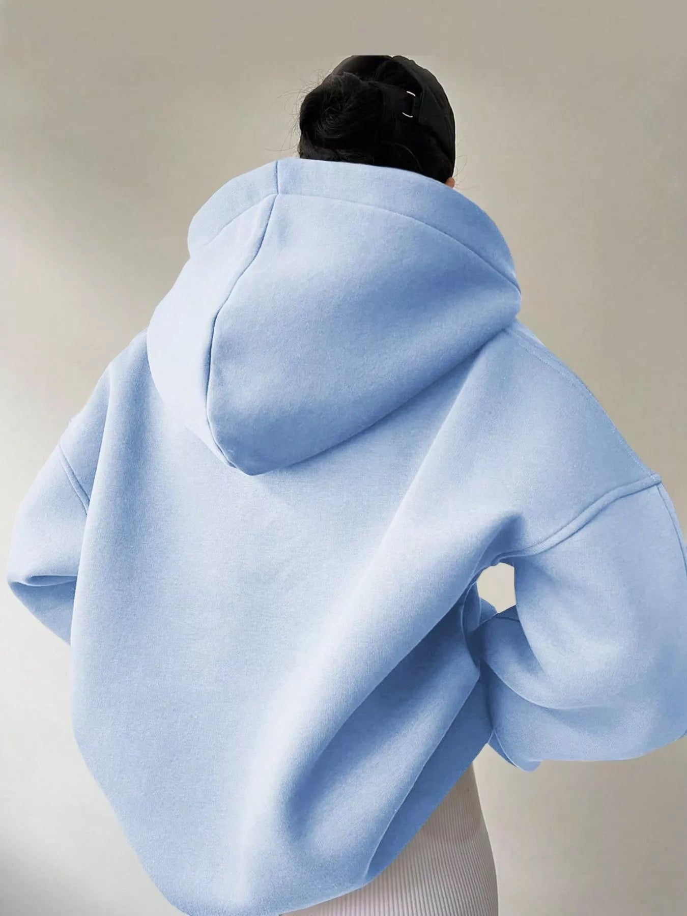 Women's oversized dropped shoulder hoodie sweatshirt in light blue with long sleeves and relaxed fit, perfect for casual fall outfits, available in 11 colors and sizes Small–2XL.