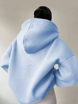 Women's oversized dropped shoulder hoodie sweatshirt in light blue with long sleeves and relaxed fit, perfect for casual fall outfits, available in 11 colors and sizes Small–2XL.