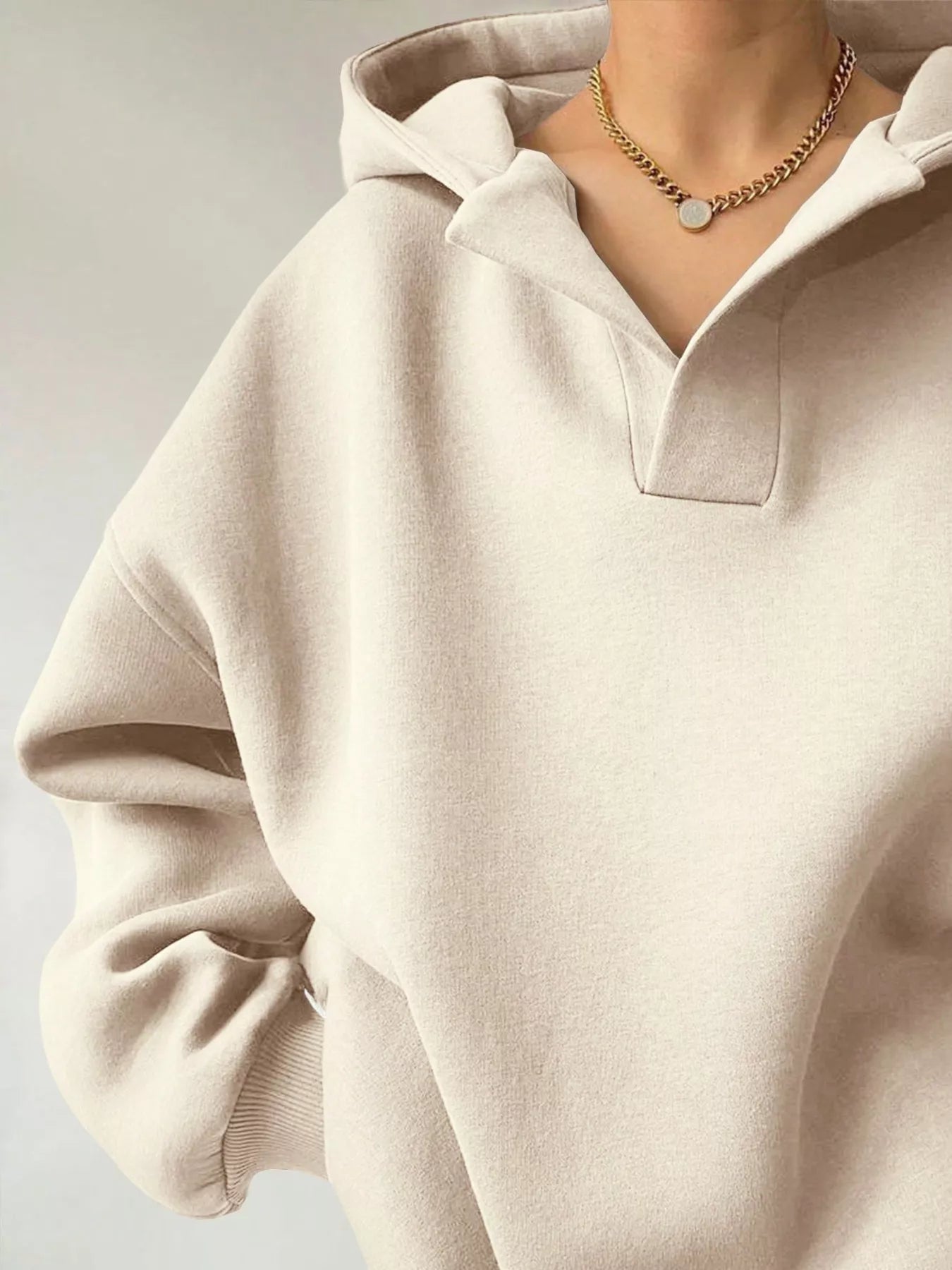 Women's oversized dropped shoulder hoodie sweatshirt in off-white with long sleeves and relaxed fit, perfect for casual fall outfits, available in 11 colors and sizes Small–2XL.