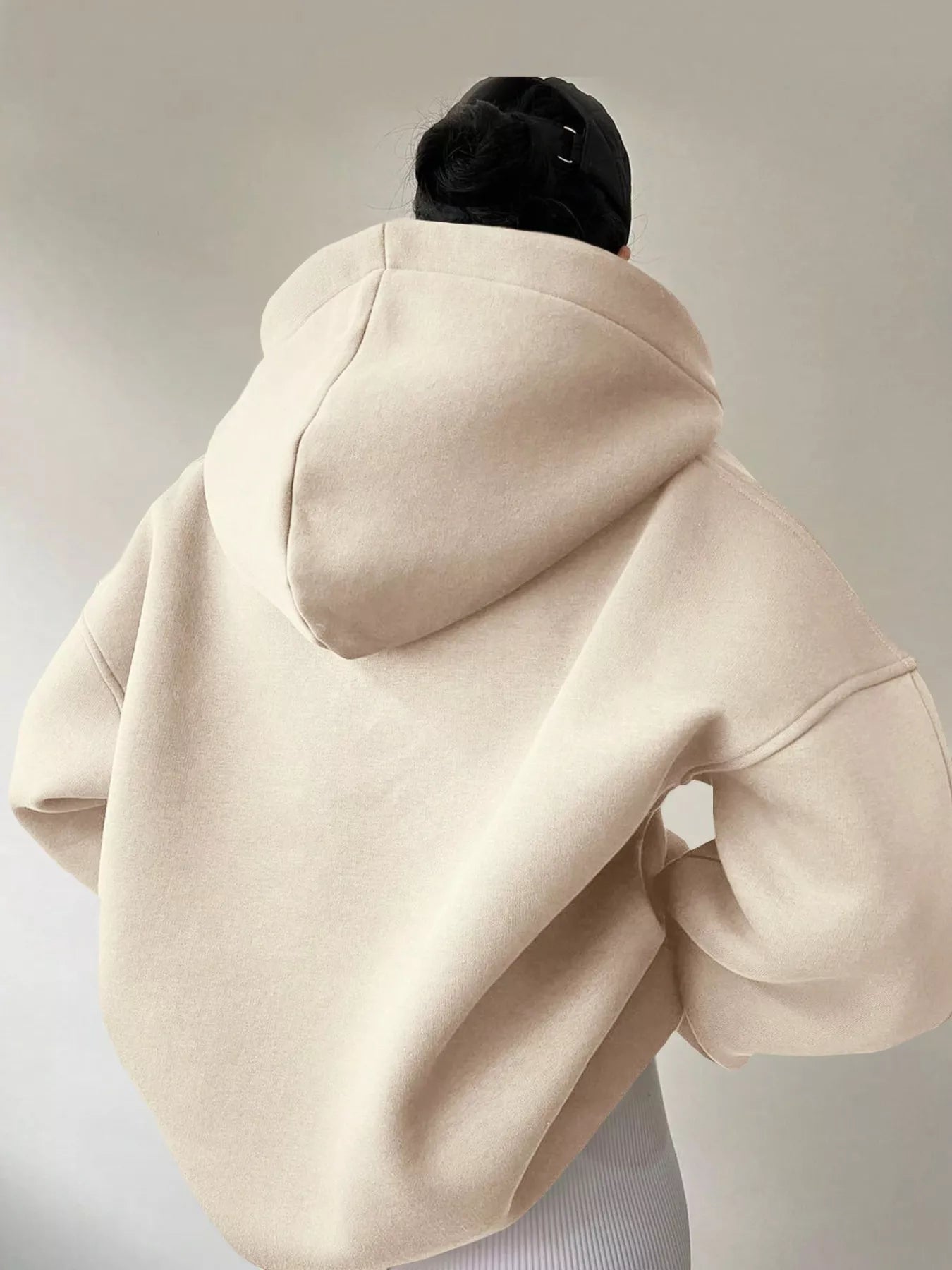 Women's oversized dropped shoulder hoodie sweatshirt in off-white with long sleeves and relaxed fit, perfect for casual fall outfits, available in 11 colors and sizes Small–2XL.
