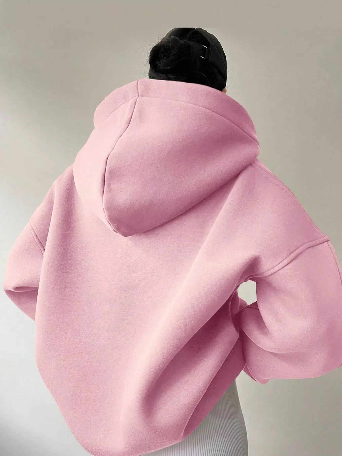 Women's oversized dropped shoulder hoodie sweatshirt in pink with long sleeves and relaxed fit, perfect for casual fall outfits, available in 11 colors and sizes Small–2XL.