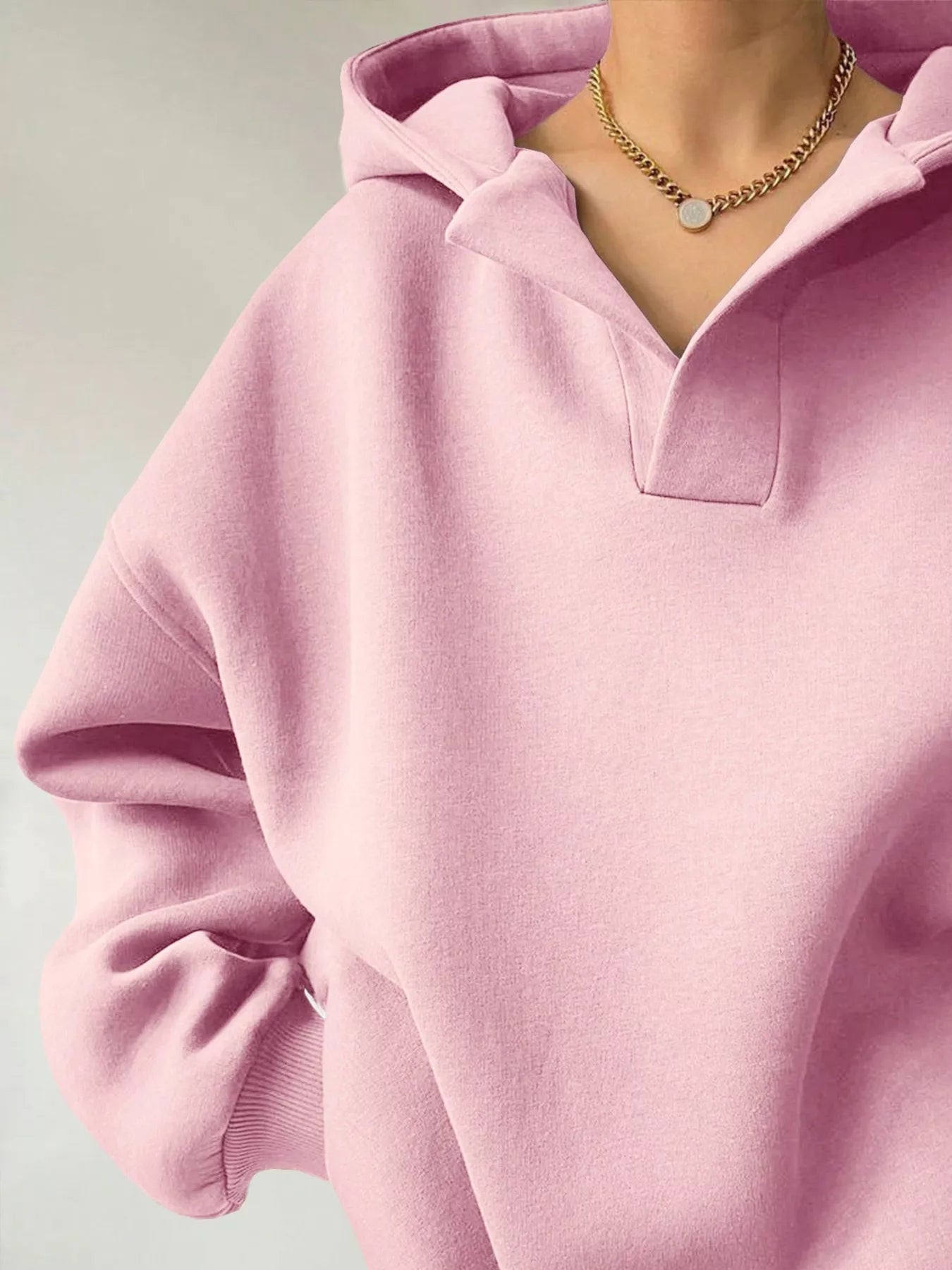 Women's oversized dropped shoulder hoodie sweatshirt in pink with long sleeves and relaxed fit, perfect for casual fall outfits, available in 11 colors and sizes Small–2XL.