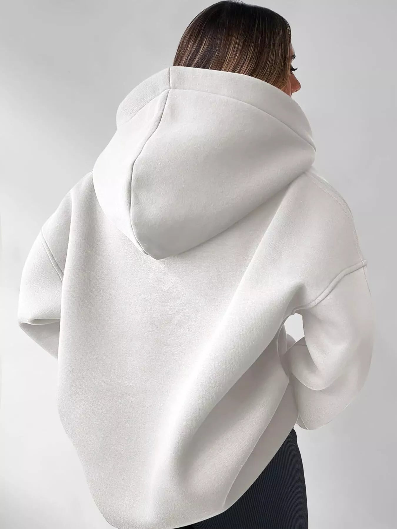 Women's oversized dropped shoulder hoodie sweatshirt in white with long sleeves and relaxed fit, perfect for casual fall outfits, available in 11 colors and sizes Small–2XL.