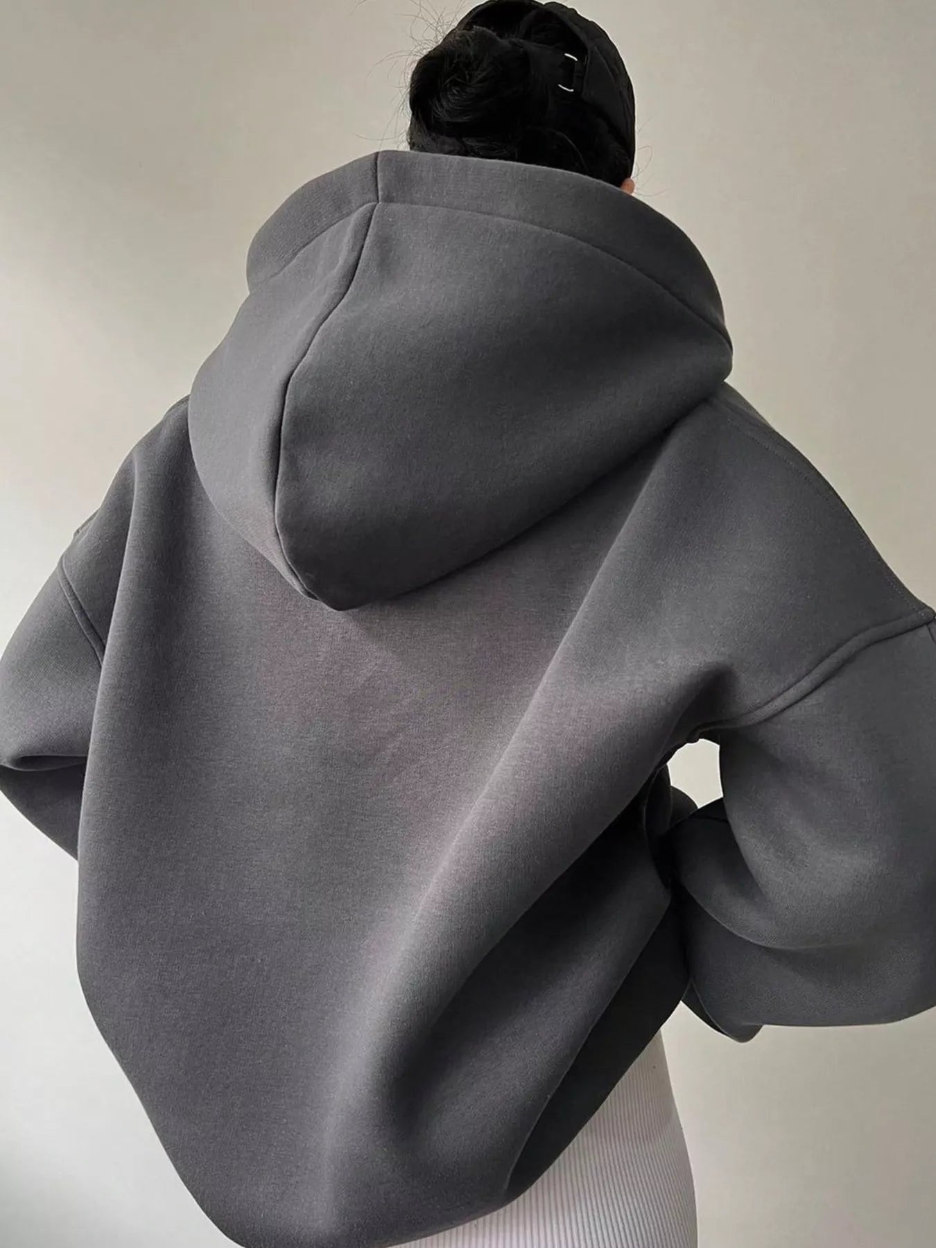 Women's oversized dropped shoulder hoodie sweatshirt in dark gray with long sleeves and relaxed fit, perfect for casual fall outfits, available in 11 colors and sizes Small–2XL.