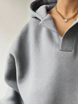 Women's oversized dropped shoulder hoodie sweatshirt in light gray with long sleeves and relaxed fit, perfect for casual fall outfits, available in 11 colors and sizes Small–2XL.