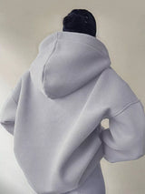 Women's oversized dropped shoulder hoodie sweatshirt in light gray with long sleeves and relaxed fit, perfect for casual fall outfits, available in 11 colors and sizes Small–2XL.
