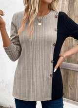 Women’s dust storm and black color block ribbed knit long sleeve top with decorative side buttons and slit detail, available in sizes Small–2XL.