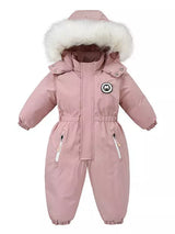 Children's dusty pink one-piece winter snowsuit featuring a fluffy white faux fur-trimmed hood, rust-colored accents, elasticized waist, and front pockets.
