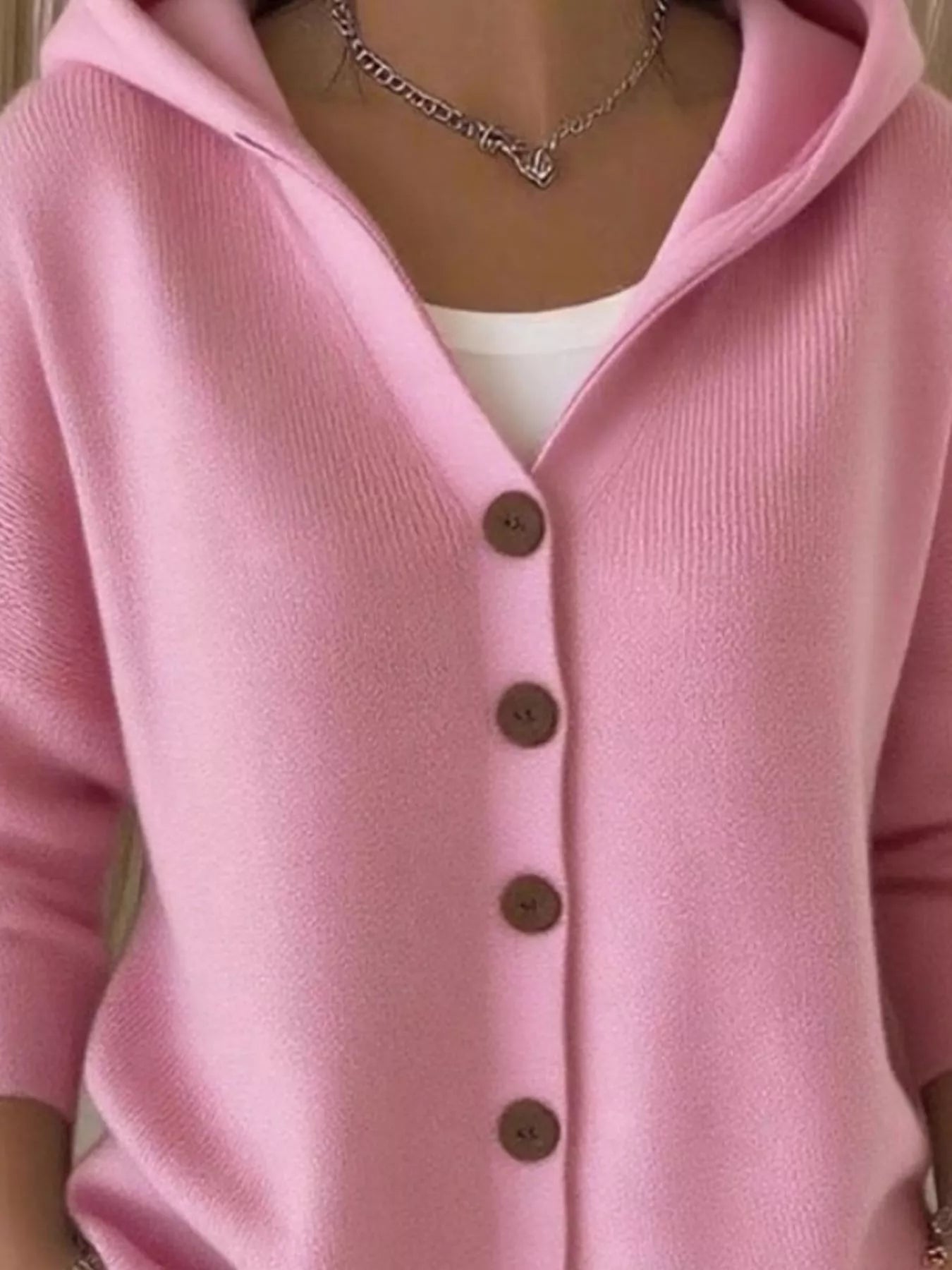 Women's pink button-up knit cardigan with hood and front pockets, long sleeve lightweight sweater styled with white pants, available in sizes Small–5XL.