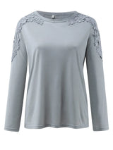 Gray long-sleeve top with lace details on a white background