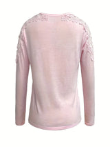 Blush Pink long-sleeve top with floral embellishments on a white background