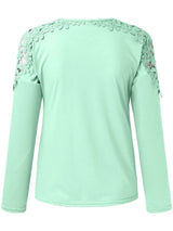 Light green long-sleeve top with floral lace details on a white background