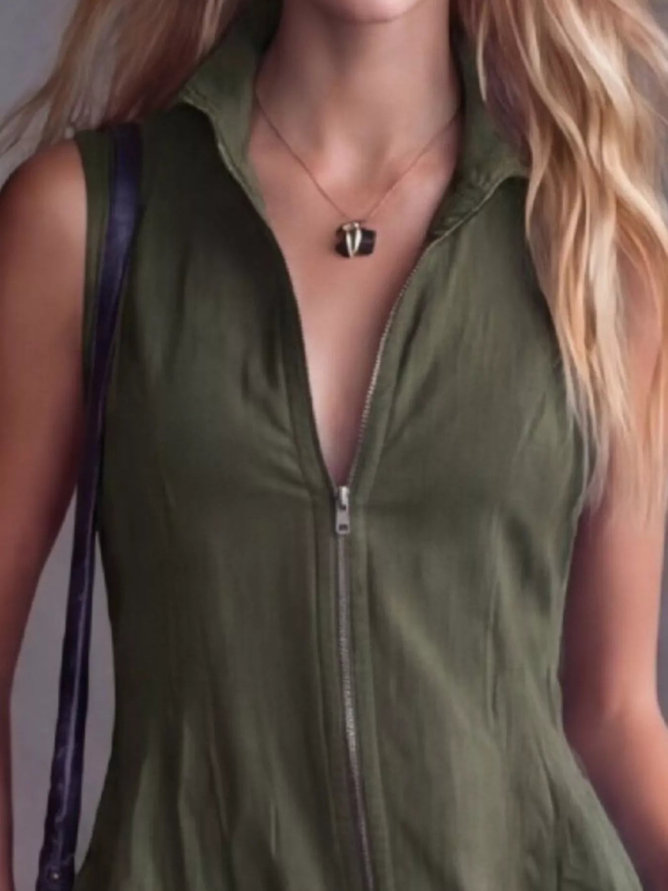 Women's army green high-low ruffled sleeveless maxi dress featuring a zip-front closure. Elegant boutique dress perfect for fall festivals, winery weekends, date nights, and boho-inspired outfits.